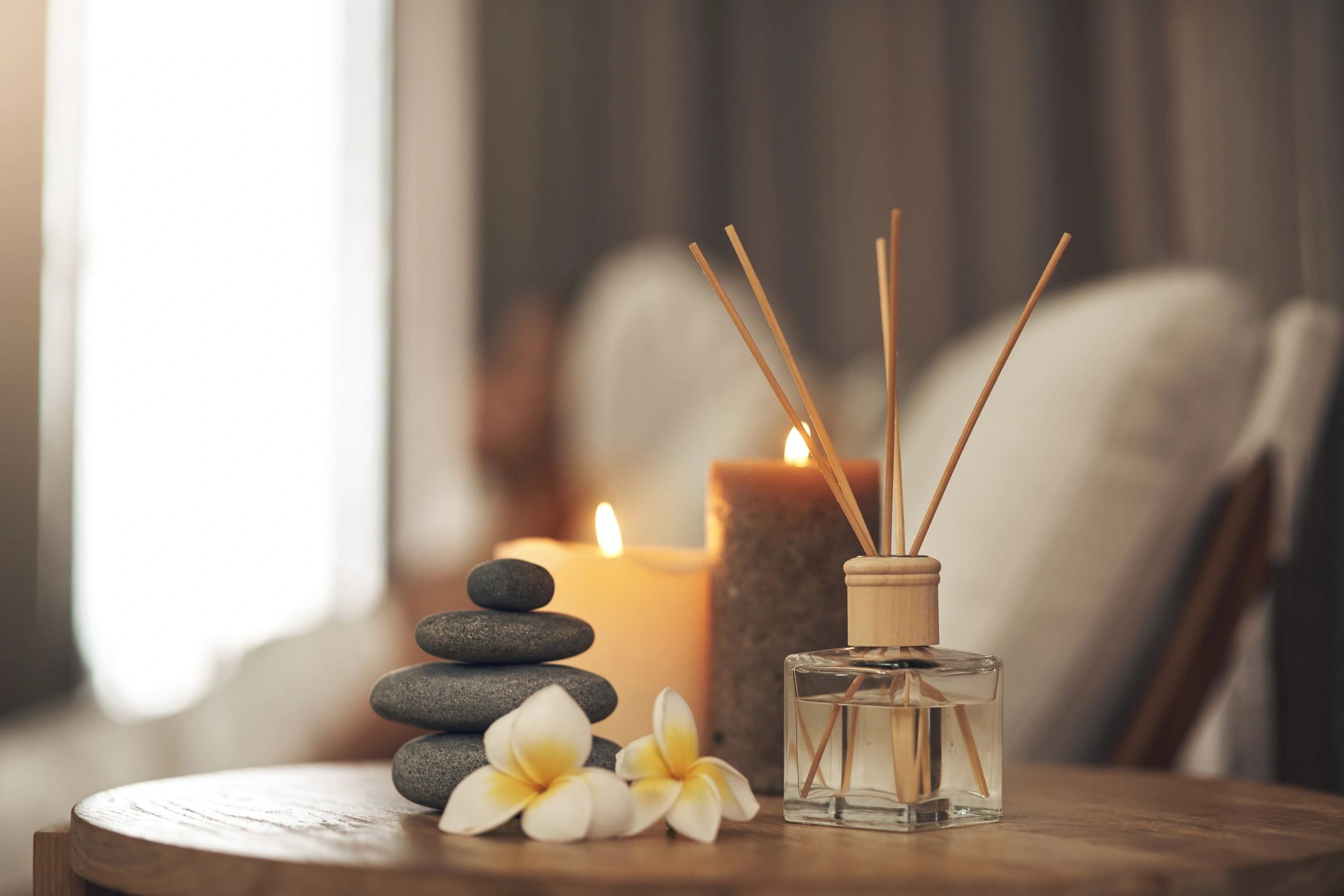 Still life closeup of a tranquil spa arrangement with candle
