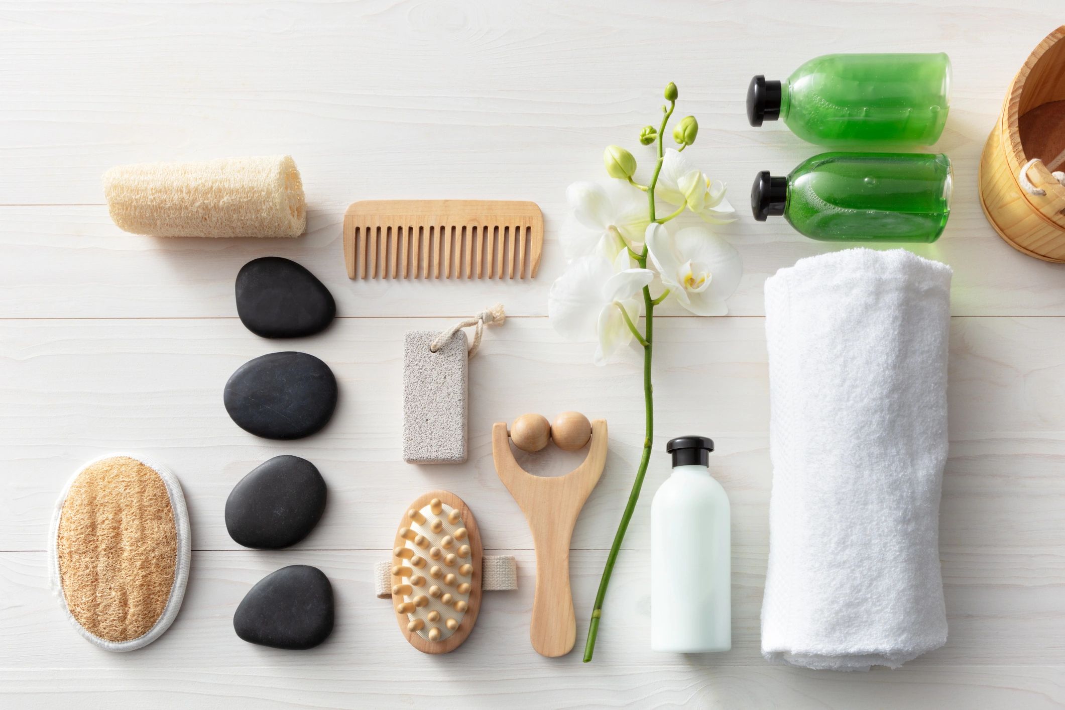 Luxury handmade wellness products styled in a soft neutral flat lay